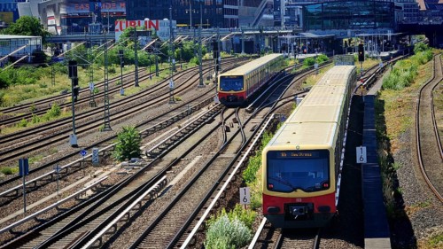 Trains on extensive railway tracks in urban surroundings with modern architecture, Berlin