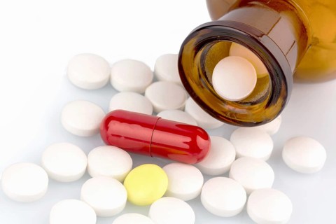 Lots of tablets with a container. Lying on a white background, Austria