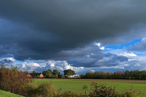 Rain clouds (Nimbostratus) and landscape, the Netherlands