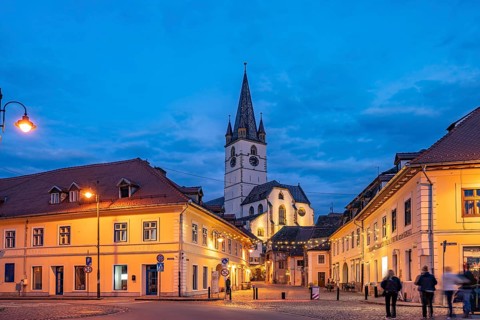 Old town and the Lutheran parish church in Sibiu or Sibiu at dusk, Transylvania, Romania
