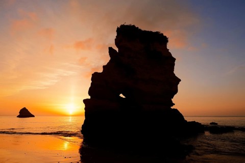 Rock formation on the coast at sunrise, Praia Dona Ana, Lagos, Algarve, Portugal