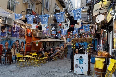 Street scene at Spaccanapoli, pizzeria with soccer decoration, historic old town, Naples, Campania,