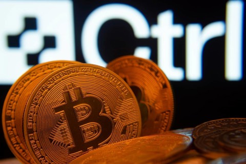 Dhaka, Bangladesh- 27 March 2025: Close-up of Bitcoin coins with the Ctrl Wallet logo visible on a