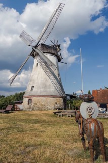 Historic windmill with Don Quixote in Lechtingen, Wallenhorst, Lower Saxony, Germany