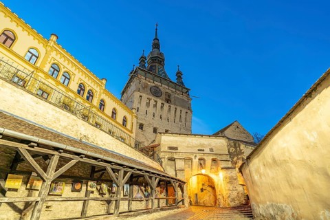 Stairway to the citadel and hour tower at dusk, Sighisoara or Sighi?oara, Transylvania, Romania