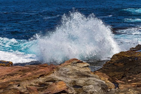 Waves crash into rocks on the coastline at Maroubra, Sydney, New South Wales, Australia