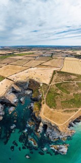 Panorama of Farms and Fields over Cliffs and Porthcothan Bay from a drone, Porthcothan, Padstow,
