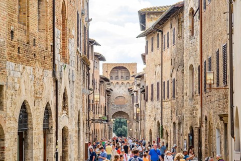 Old Town with stone arches and historic buildings of San Gimignano, Tuscany, UNESCO World Heritage,