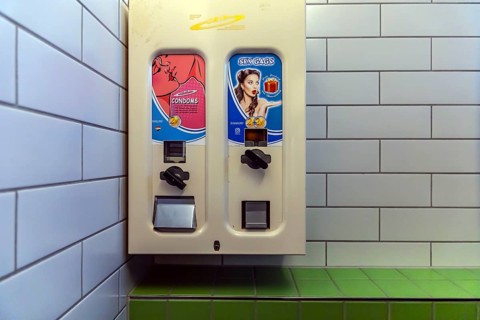Condom machine in a men's restroom. Stuttgart, Baden-Württemberg, Germany