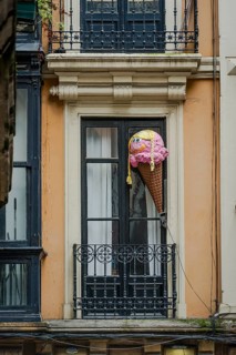 Large replica of ice cream in a waffle above an ice cream parlour, Bilbao, Spain