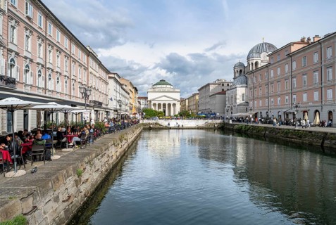 Restaurants on the Grand Canal with reflection, Sant'Antonio Taumaturgo Church in the back, Borgo