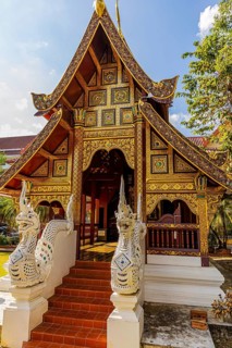 Staircase decorated with dragon heads to a public prayer hall in the Wat Phra Singh Buddhist temple