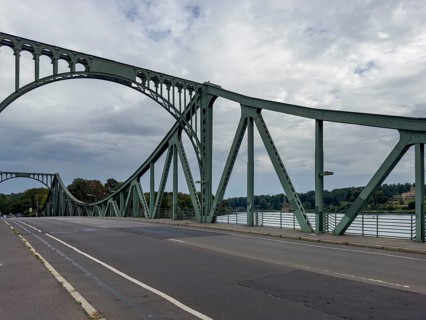Glienicke bridge. The Glienicke Bridge today forms the city border between Berlin and Potsdam and