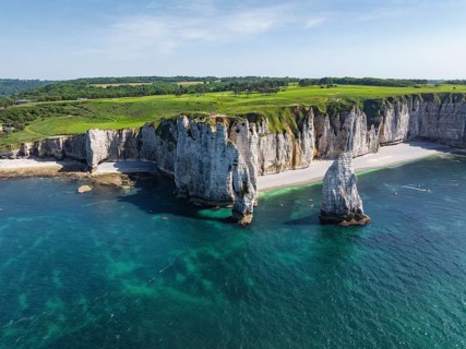Aerial view of the Porte d'Aval rock formation, a tourist attraction on the chalk coast with the