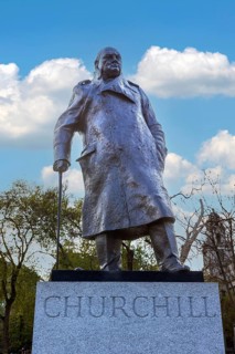 Ivor Roberts-Jones's bronze statue of Sir Winston Churchill stands in Parliament Square opposite