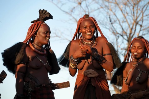 Himba woman dancing euphorically, traditional dance, traditional Himba village, Kaokoveld, Kunene,