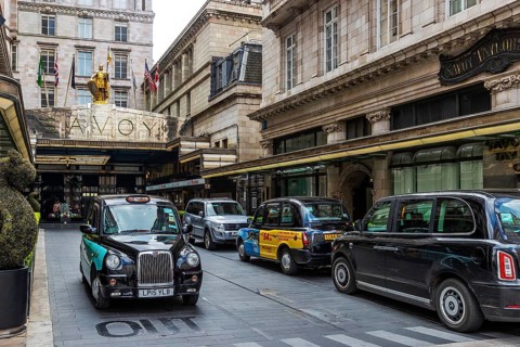 Black cabs drive on the right through Savoy Court, the only street in Britain permitting right hand