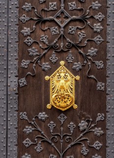 Detailed photo, gilded ornaments at the gates to the entrance of the Old Town Hall in Frankfurt am