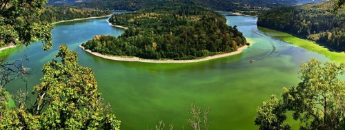 Panoramic view from the Heinrichstein rock massif Lookout point, of an island covered by forests in