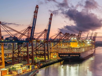 Aerial view at Waltershof harbour during the Blue Hour at the berths of Eurogate Container Terminal