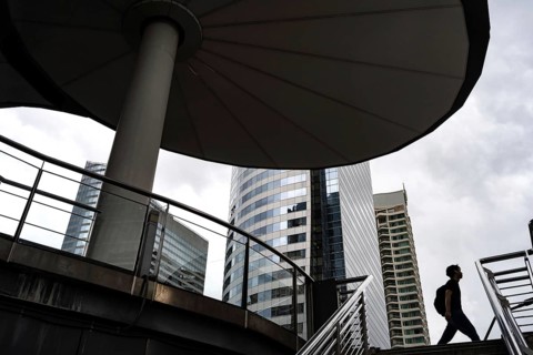 Bangkok, Thailand. August 18th 2026. Office workers and modern office buildings in the Sathorn