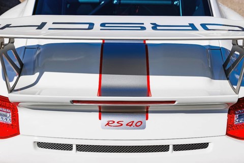 Rear wing and RS 4.0 badge of a Porsche 911 GT3 RS 4.0 at a classic car meet