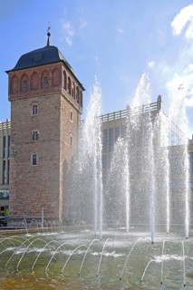Historic Red Tower built 12th century, landmark and town hall fountain, water fountains with water