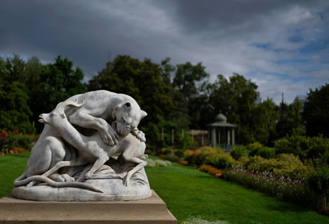 Panther jumping on the back of a gazelle, historic animal sculpture made of Carrara marble,