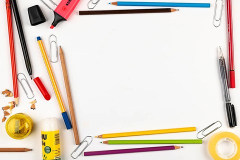 Frames made of office supplies such as pens, markers, glue on a white background