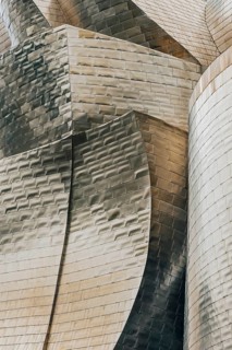Exterior view of the Guggenheim Museum with light-reflecting titanium plates in Bilbao, Spain