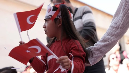 Children celebrate the 102nd anniversary of the Republic Day of Turkey, a national holiday