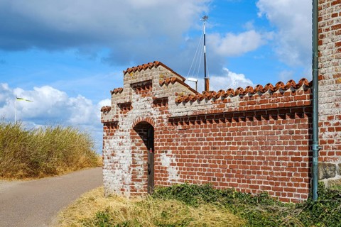 Historic red brick wall structure, in Torekov, Skåne, Sweden. A historic red-brick wall in Torekov,
