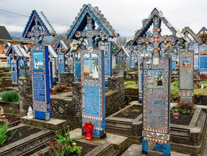 Colourfully painted wooden crosses in the cheerful Cimitirul Vesel cemetery, Sapân?a, Maramure?,