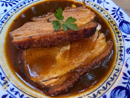 Old Bavarian Munich pork roast with crust, dark beer sauce, on plate, food, Munich, Bavaria,