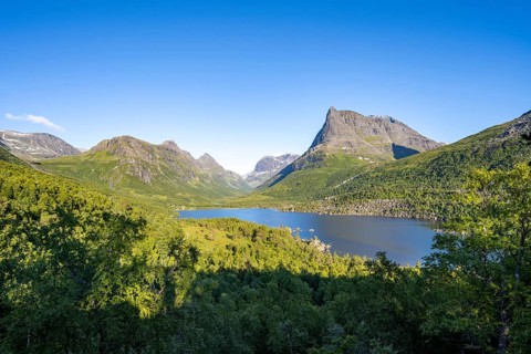 Picturesque mountain landscape in the Innerdalen high valley, Innerdalstårnet peaks and Lake