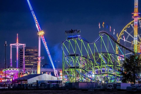 Rhine fair in the Rheinwiesen in Düsseldorf-Oberkassel, rides in the evening, with lots of