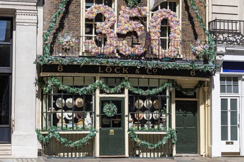 A giant floral 350 marks Lock and Co Hatters' anniversary above its shopfront on St James's Street,