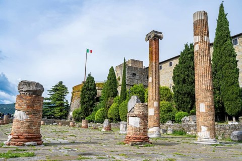 Ruins of the ancient Roman Forum on the San Giusto hill, in the back Castello di San Giusto,