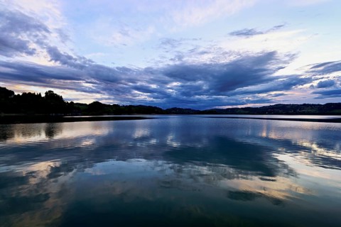 Cloud formation over Lac d'Aiguebelette, Large Natural Lake, at the foot of the Épine Mountains,