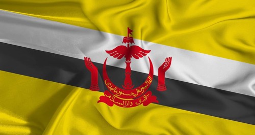 Colorful flag of Brunei with a silky fabric texture waving. Realistic Brunei flag waving