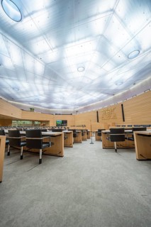 Modern meeting room with wooden details and large ceiling lights, Parliament of Baden-Württemberg,