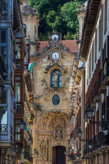 The shopping street Calle Mayor with the Basilica of Santa María del Coro in San Sebastian, Basque