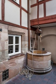 Old fountain in a historic courtyard, Obere Krämergasse 16, Nuremberg, Middle Franconia, Bavaria,