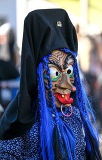 Member of a fools' guild in traditional Haes, fools' clothes, during the carnival procession in