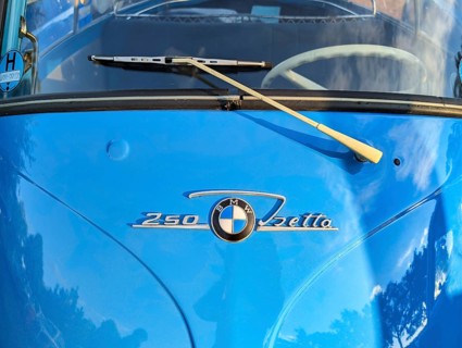 Lettering and emblem, blue BMW Isetta, distinctive small car with front door, detail of the front,