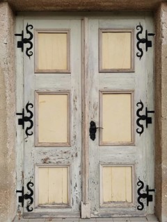 Old, weathered wooden door with metal decorations, Thuringia