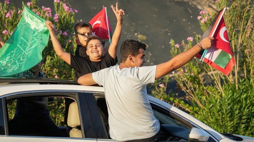 Gaziantep, Turkey - August 06, 2026: A convoy of vehicles decorated with Palestinian flags drives