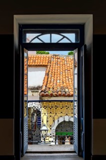 Open door in an ancient colonial house overlooking the historic center of Sao Luis, Maranhao, Sao