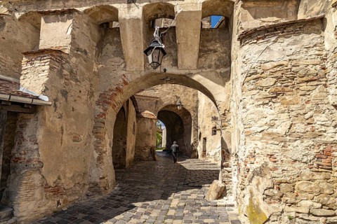 Portal to the citadel under the hour tower in Sighisoara or Sighi?oara, Transylvania, Romania