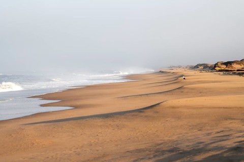 Waves burn on the Atlantic coast, sandy beach in the Namib Desert, desert landscape, Namib Naukluft
